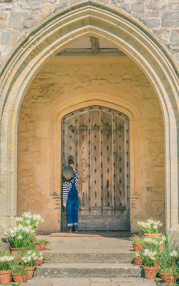 Photograph-of-Little-Boy-knocking-on-the-Front-Door-of-Nymans-National-Trust-property, West-Sussex
